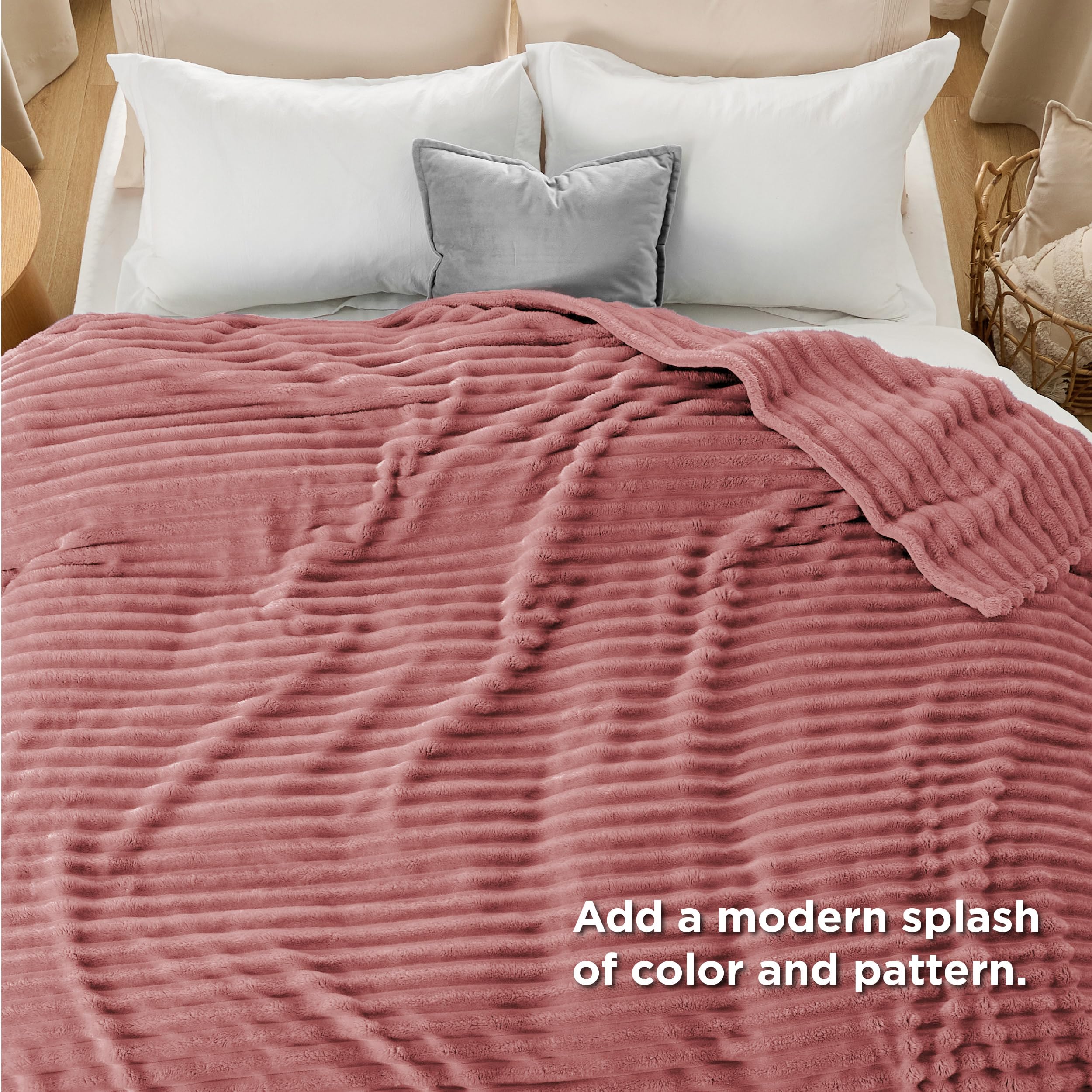 Bedsure GentleSoft dusty pink fleece blanket shows neat stitching at the seams for lasting durability.