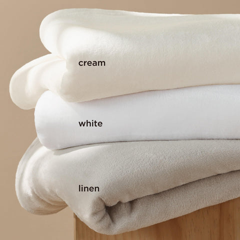 Bedsure GentleSoft fleece blanket in a bedroom cozy nook for relaxing