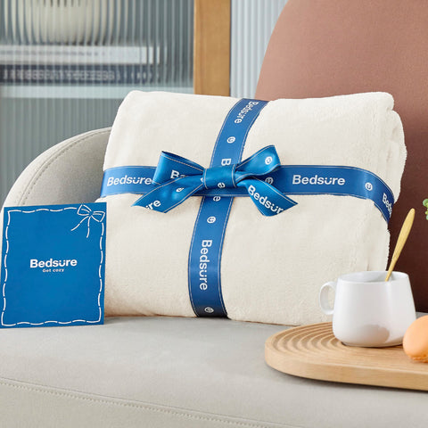 Bedsure GentleSoft blanket cream in a packable setup for easy transport.