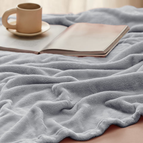 Bedsure GentleSoft blanket draped over bed for easy warmth.