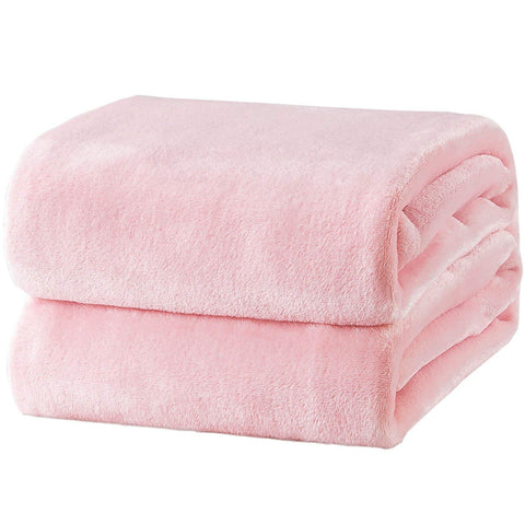 Bedsure GentleSoft fleece blanket king size pink folded on bed for cozy warmth