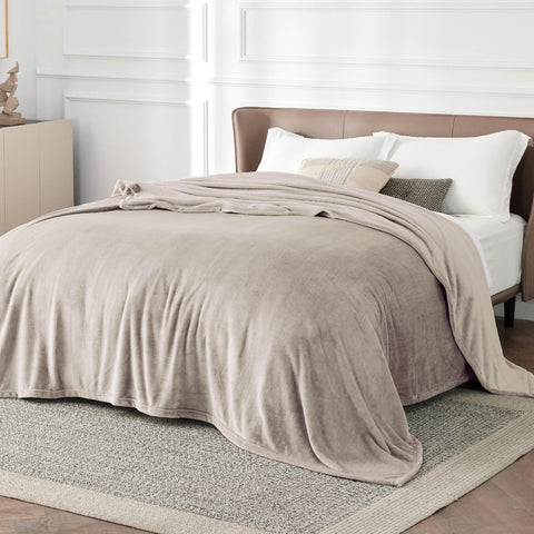 Bedsure GentleSoft fleece blanket on bed in oxford tan for warm nights