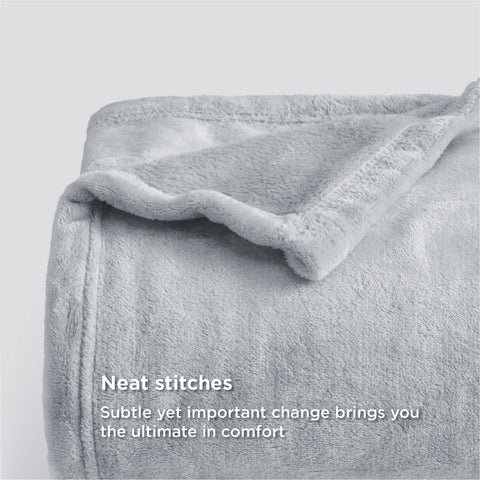 Bedsure GentleSoft fleece blanket soft texture in light grey invites cozy lounging.