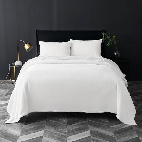 Bedsure GentleSoft fleece blanket queen size on bed, airy weight for easy snuggling.