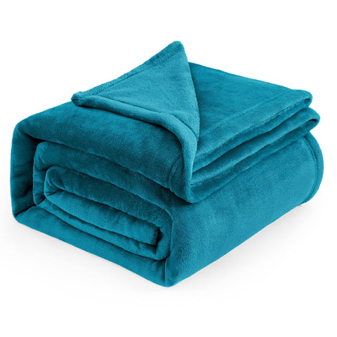 Bedsure GentleSoft fleece blanket teal queen size folded on bed for cozy evenings