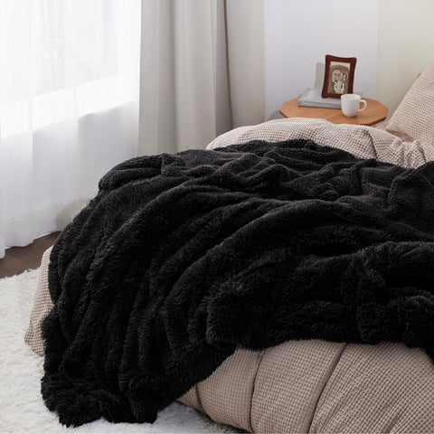 Bedsure GentleSoft throw draped on bed for soft, cozy warmth all night.