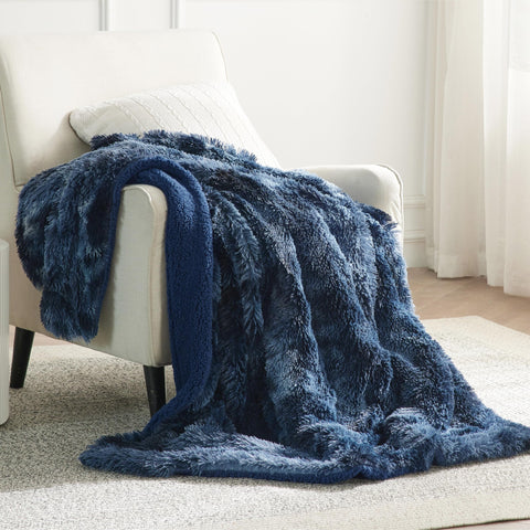 Bedsure GentleSoft Fluffy Navy Throw beside bed complements calm bedroom style.