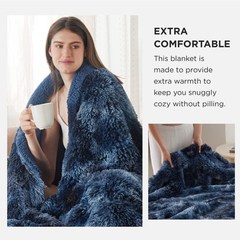 Bedsure GentleSoft Fluffy Navy Throw draped over sofa adds warm decor.