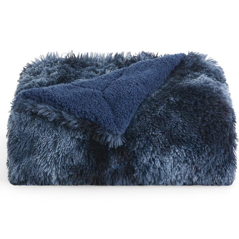 Bedsure GentleSoft Fluffy Navy Throw on couch creates cozy living room vibe.