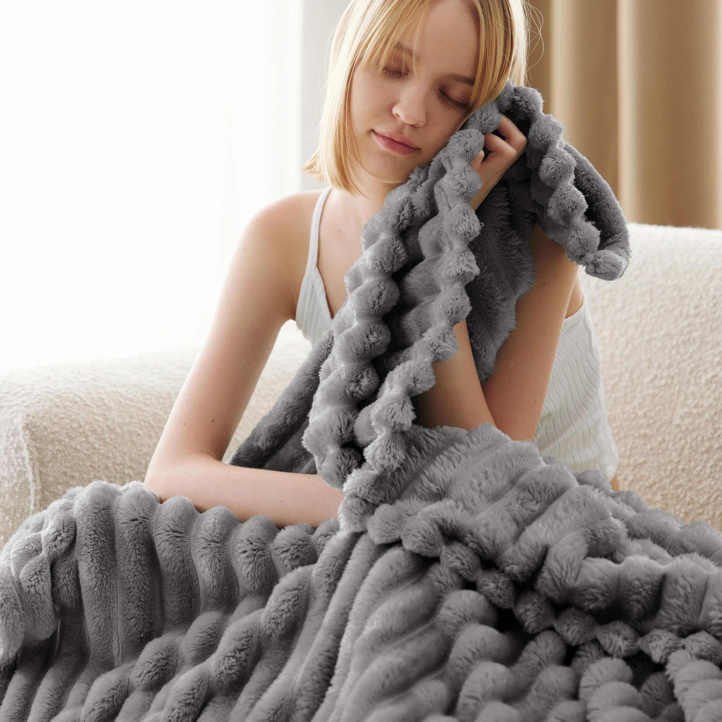 Bedsure GentleSoft Frost Gray blanket draped on bed adds warmth and style.