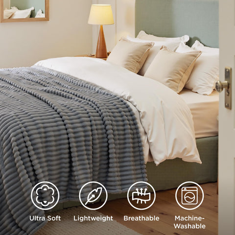 Bedsure GentleSoft Frost Gray blanket on the couch for relaxed evenings.