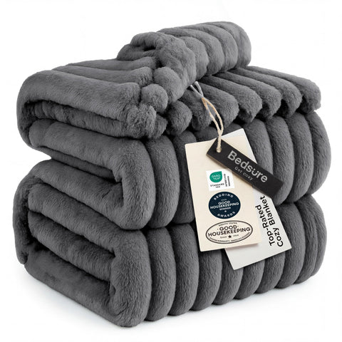 Bedsure GentleSoft Frost Gray fleece blanket on couch offers cozy warmth.