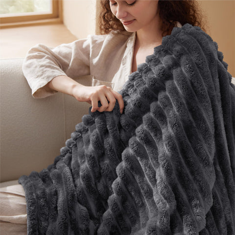 Bedsure GentleSoft grey blanket shown in a cozy nook for relaxation
