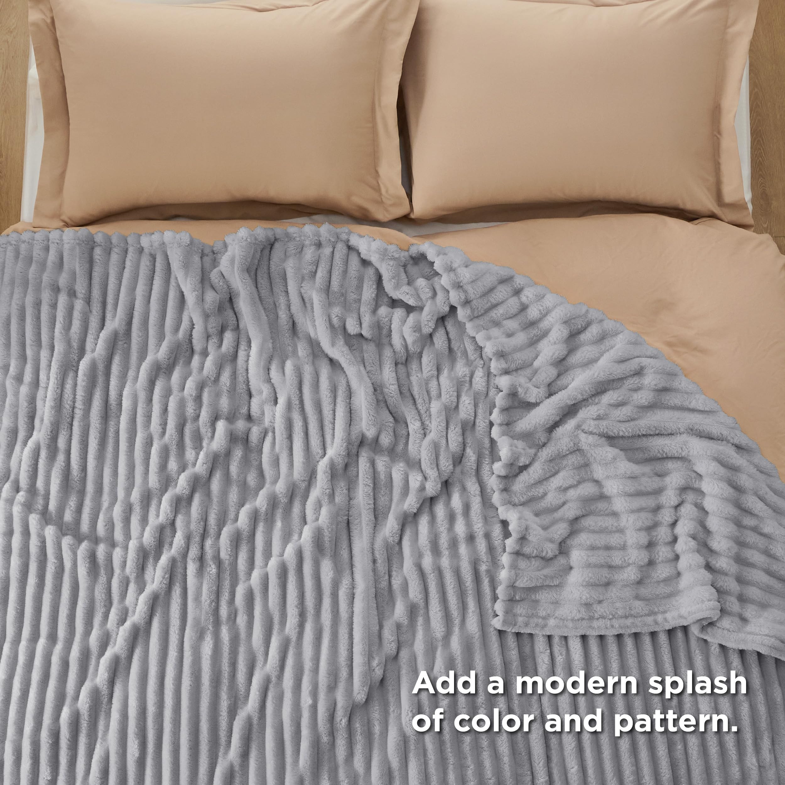 Bedsure GentleSoft king blanket on couch demonstrates snuggling comfort