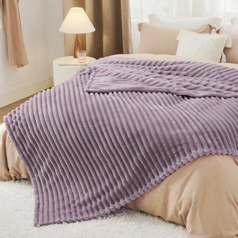 Bedsure GentleSoft draped over a chair shows versatile lounging options.