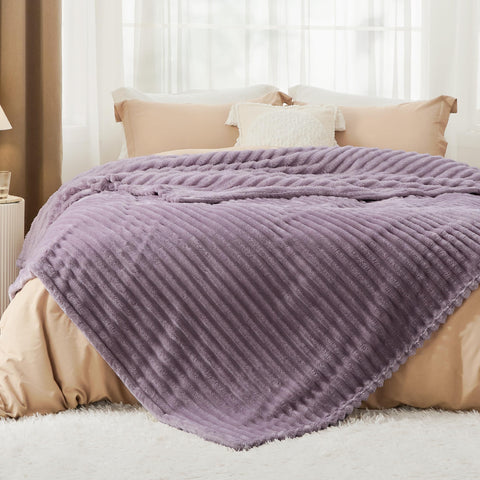 Bedsure GentleSoft blanket folded on sofa shows compact warmth for small spaces.