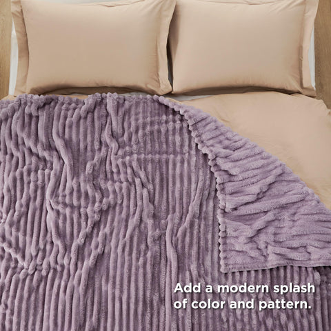 Bedsure GentleSoft blanket on bed adds a soft layer for chilly mornings.