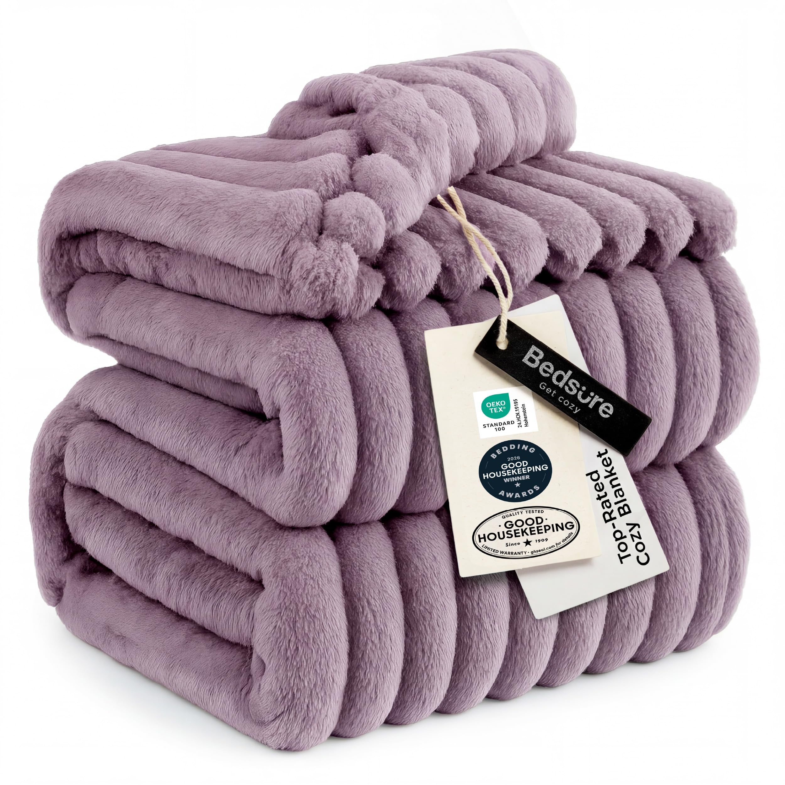 Bedsure GentleSoft light purple fleece blanket on sofa for cozy lounging.