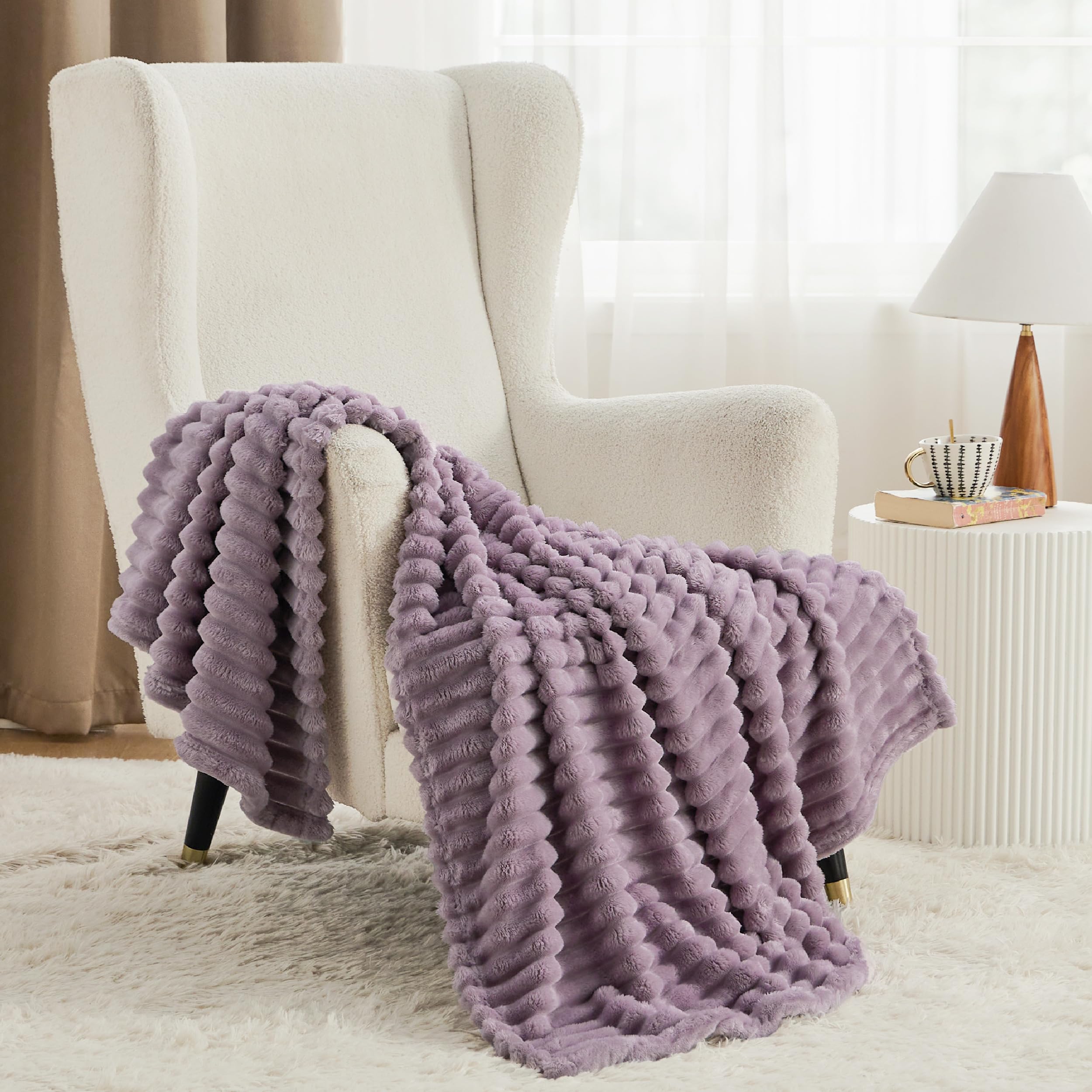 Bedsure GentleSoft throw draped over a bed for soft comfort.