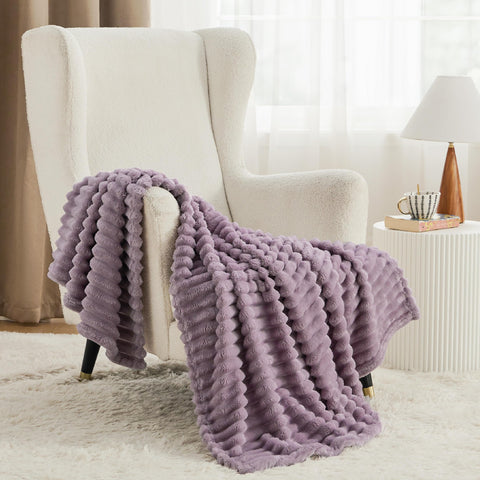 Bedsure GentleSoft throw draped over a bed for soft comfort.
