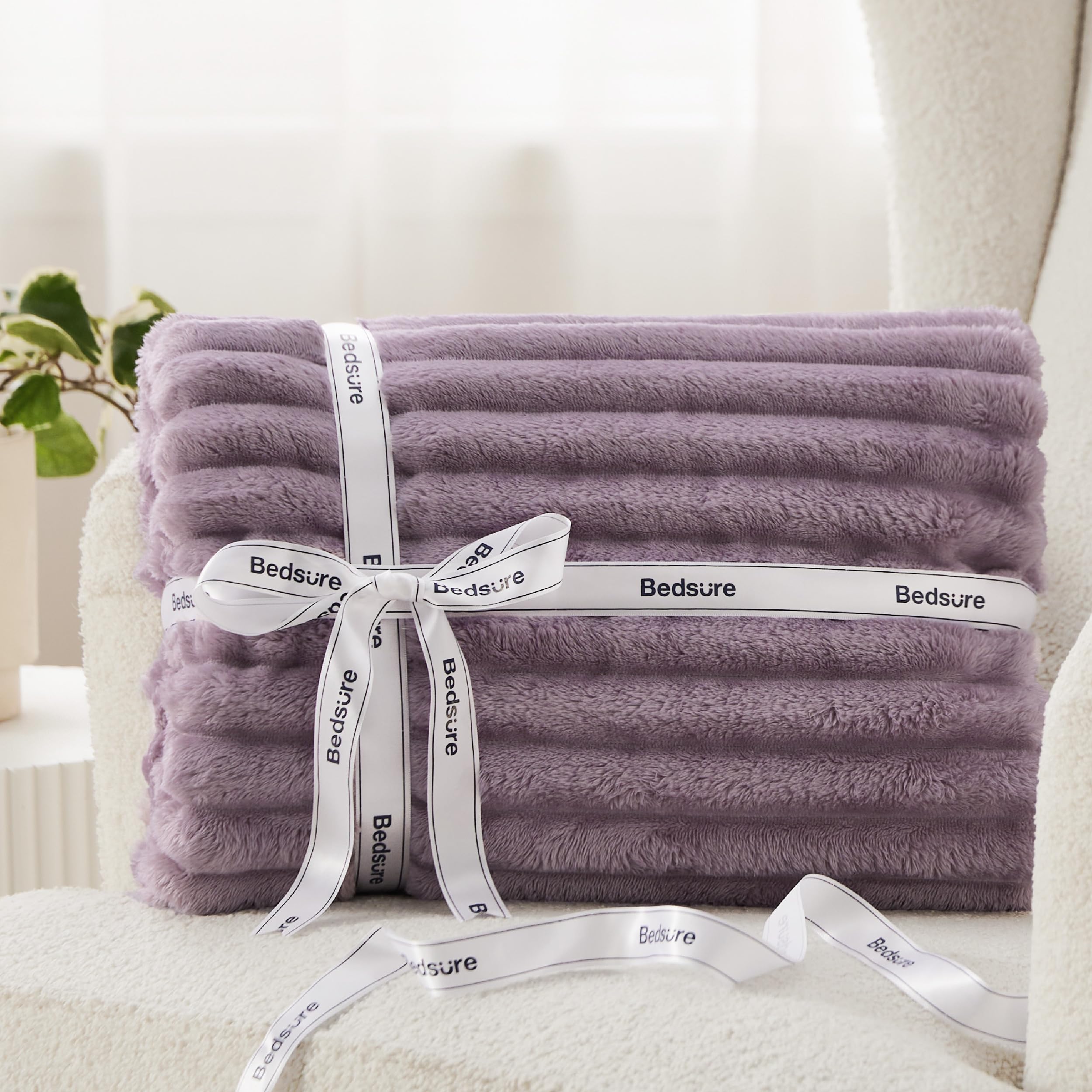 Bedsure GentleSoft throw is lightweight yet warm for year-round comfort.