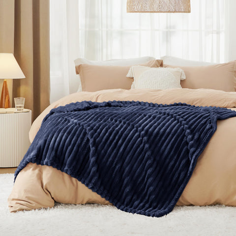 Bedsure GentleSoft navy blanket stitched edges for durability and lasting comfort.