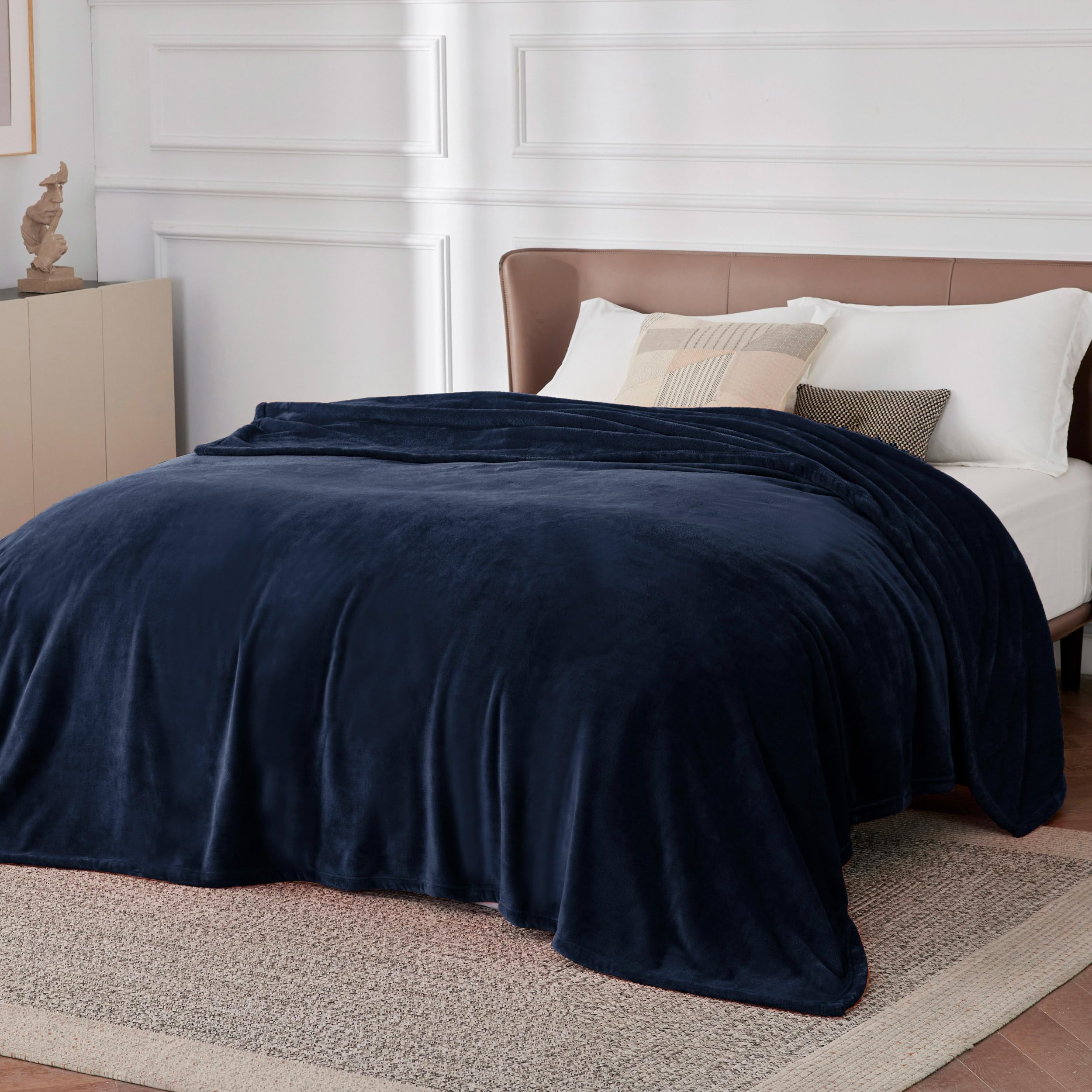 Bedsure GentleSoft navy fleece blanket as bedroom decor accent