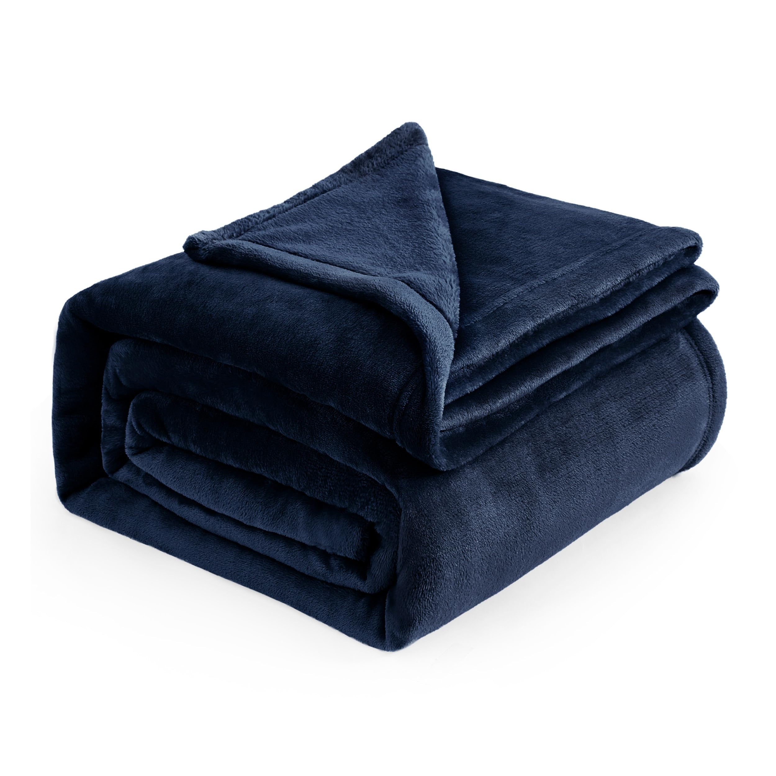Bedsure GentleSoft navy fleece blanket full view on bed for cozy warmth