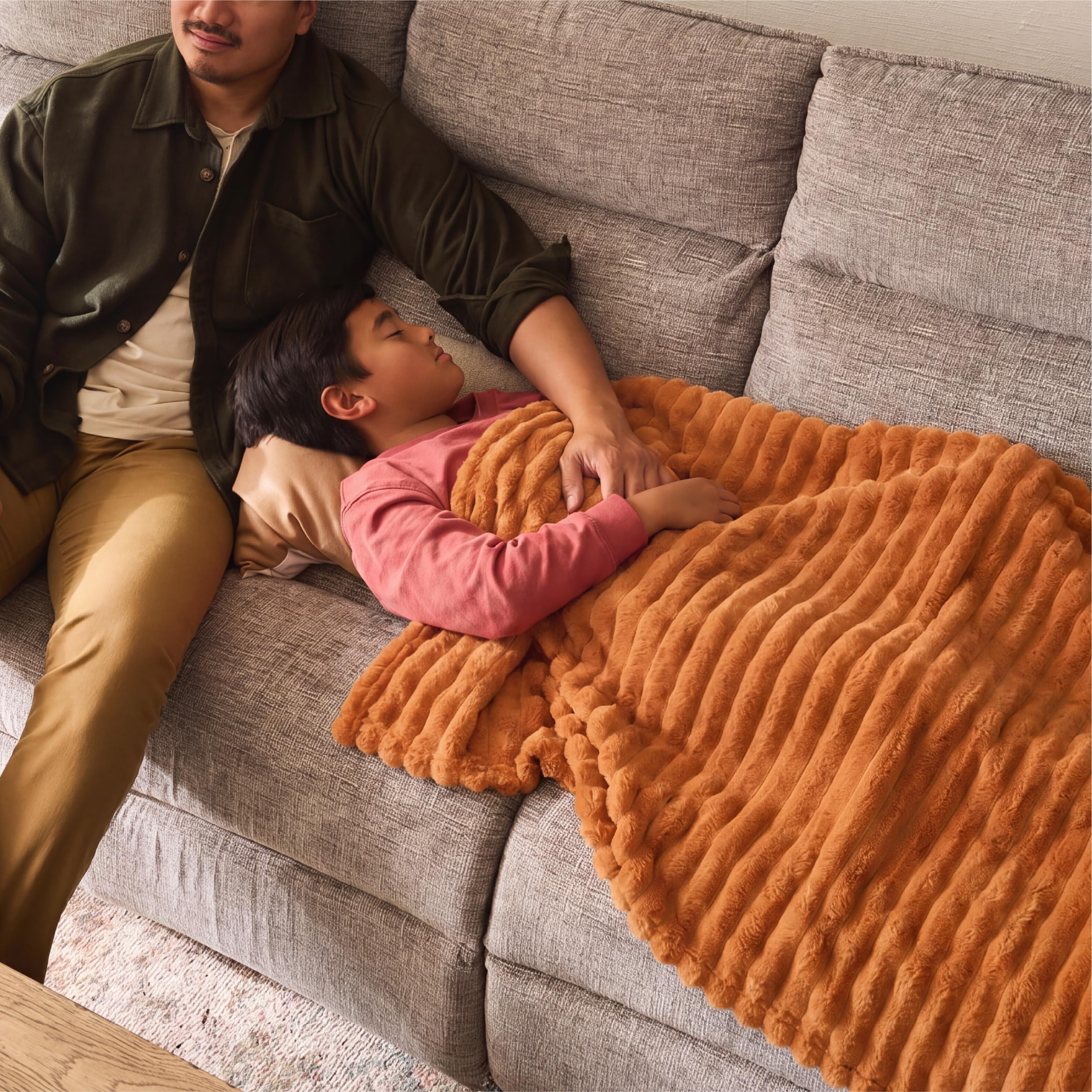 Bedsure GentleSoft orange throw adds cozy color to any room.