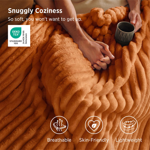 Bedsure GentleSoft orange fall throw brings soft color to living rooms.