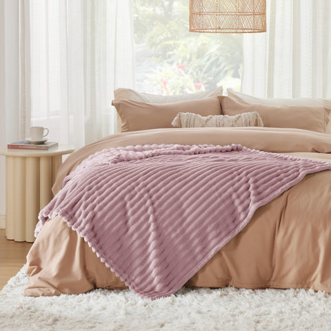 Bedsure pink GentleSoft blanket helps create a cozy office corner.