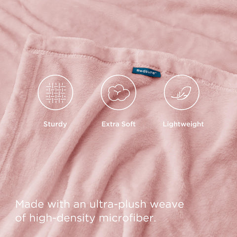 Bedsure GentleSoft pink fleece blanket draped over sofa for easy lounging warmth