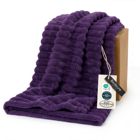 Bedsure GentleSoft purple fleece blanket on couch for cozy lounging