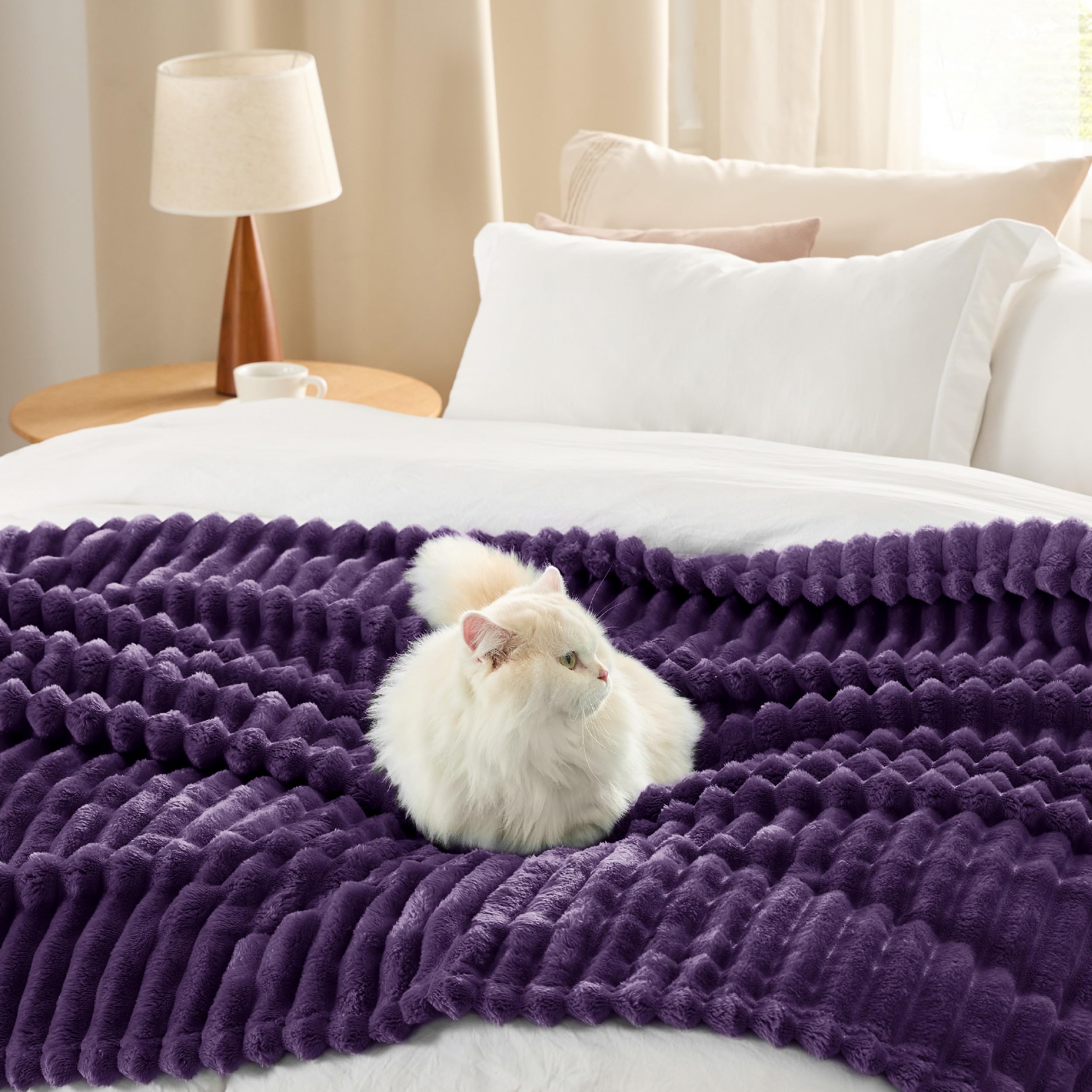 Bedsure GentleSoft purple fleece blanket in living room as decor accent