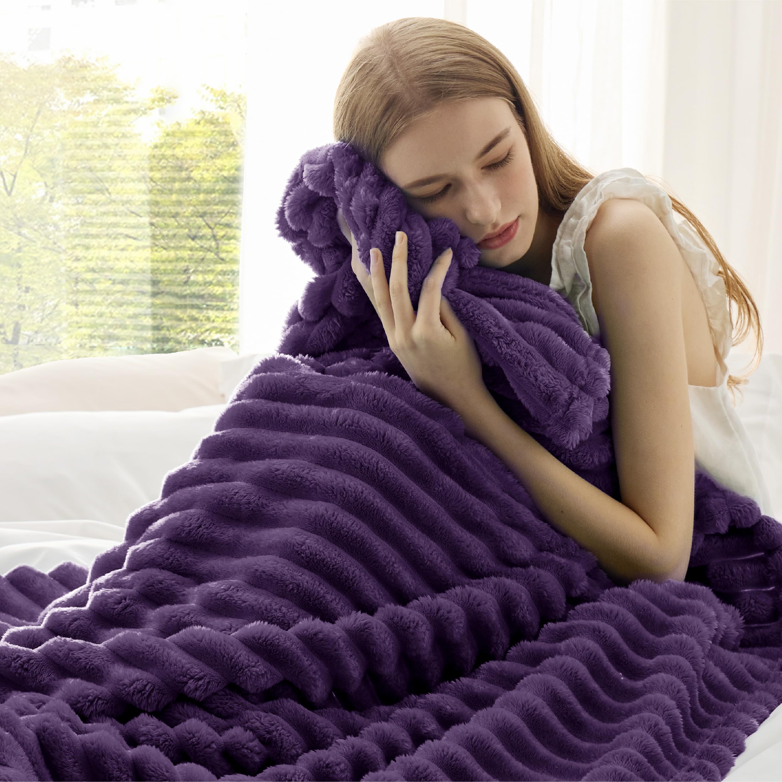 Bedsure GentleSoft purple fleece blanket on bed for relaxing nights