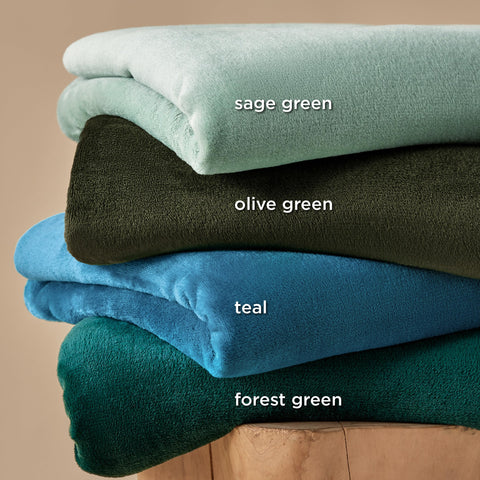 Bedsure GentleSoft sage green blanket used for camping warmth outdoors
