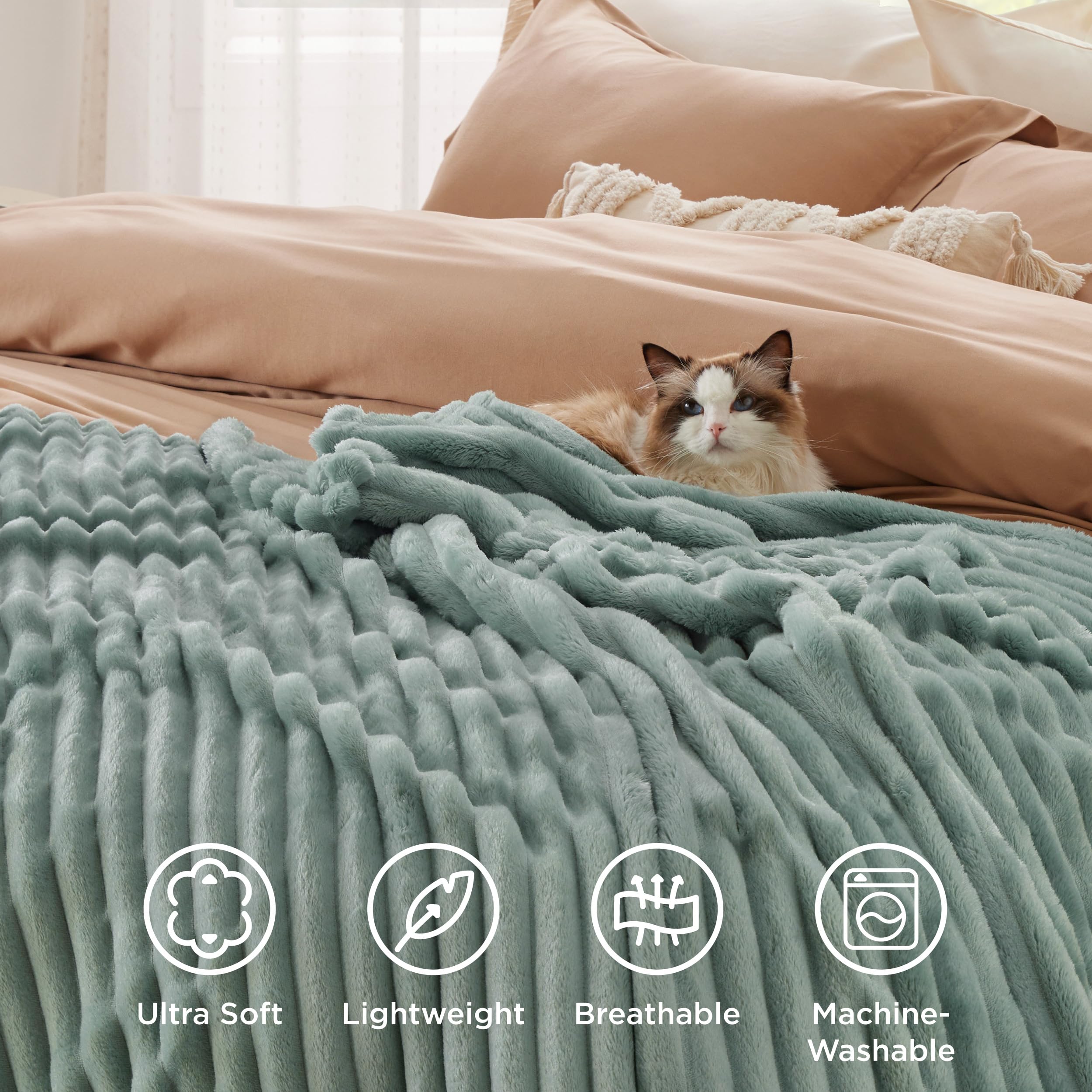 Family enjoys movie night with Bedsure GentleSoft fleece blanket on the sofa