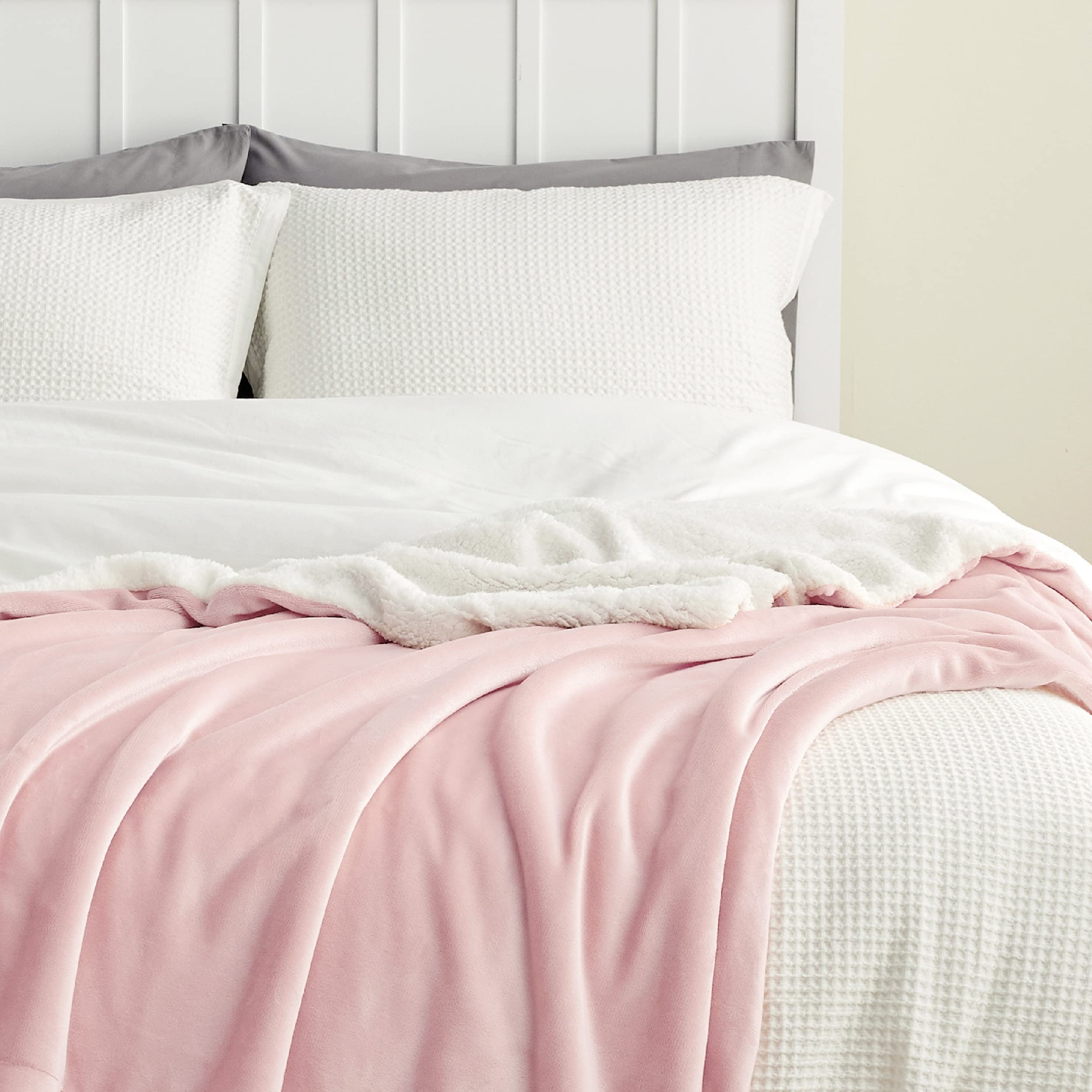 Bedsure GentleSoft Sherpa Blanket folded in a dorm room as a cozy study break companion