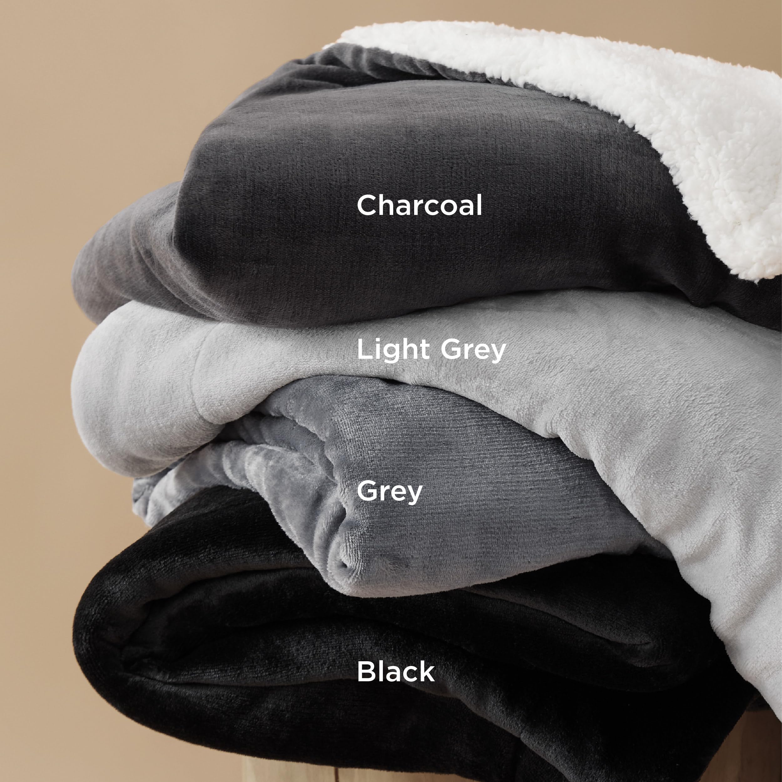 Bedsure GentleSoft sherpa throw on bed brings extra warmth.