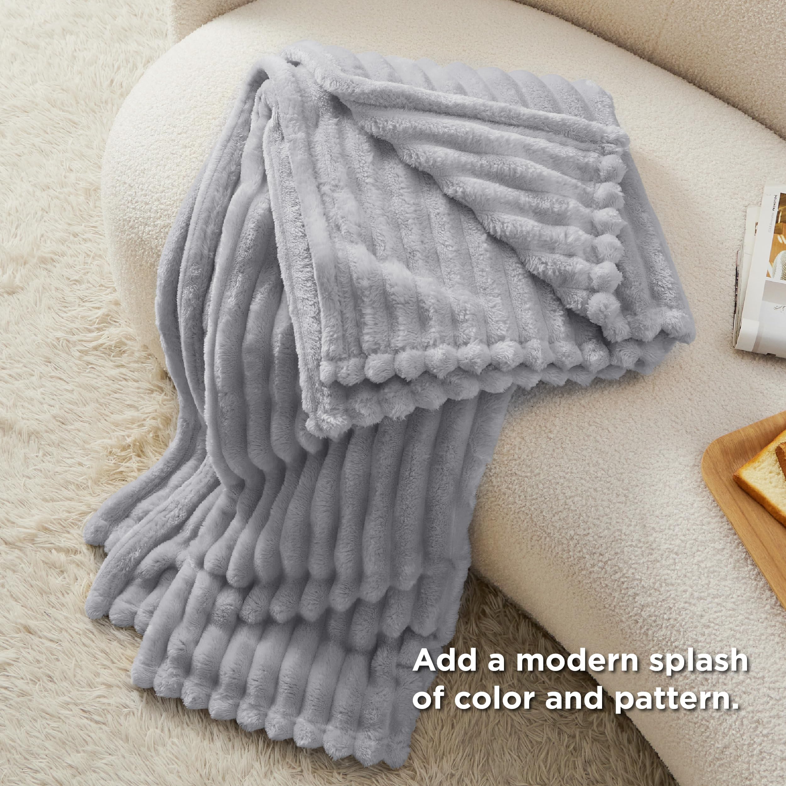 Bedsure GentleSoft folded blanket showing neat stitching and durable edge.