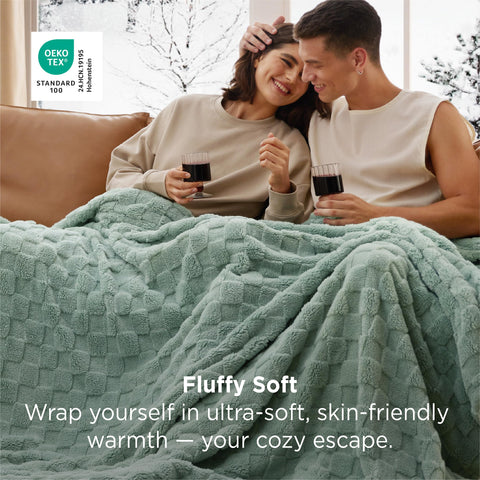 Bedsure GentleSoft twin blanket in sage green draped on a bed for chic dorm decor.