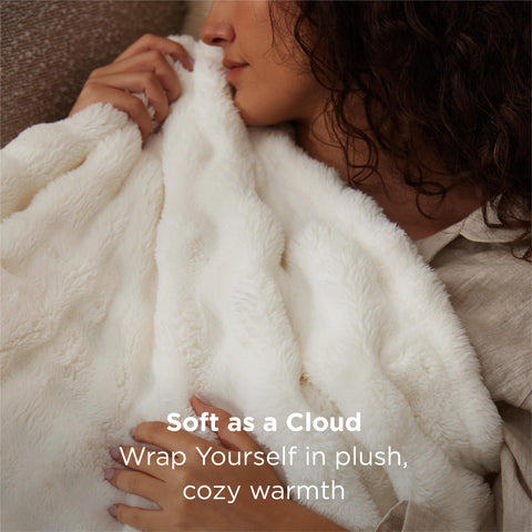 Bedsure GentleSoft White textured blanket enhances bedroom decor with plush touch.
