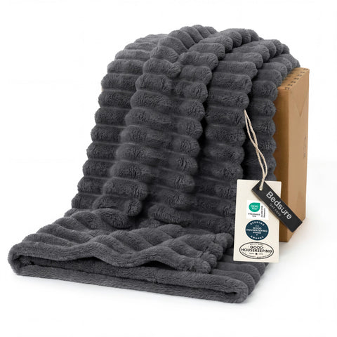 Bedsure grey fleece throw on couch offers soft warmth for cozy lounging.