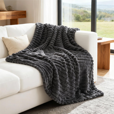 Bedsure grey fleece throw reinforced stitching for lasting durability.