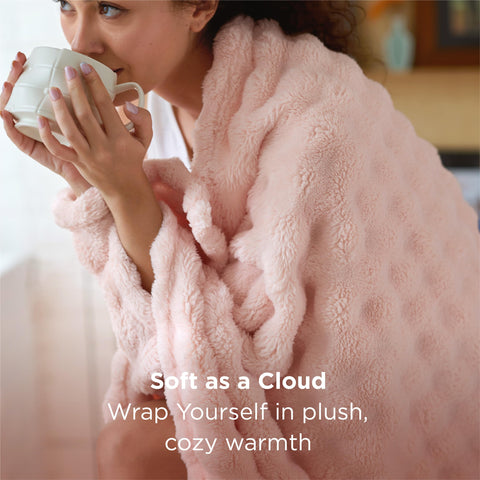 Bedsure light pink throw features plush fabric for a gentle, skin-friendly touch.