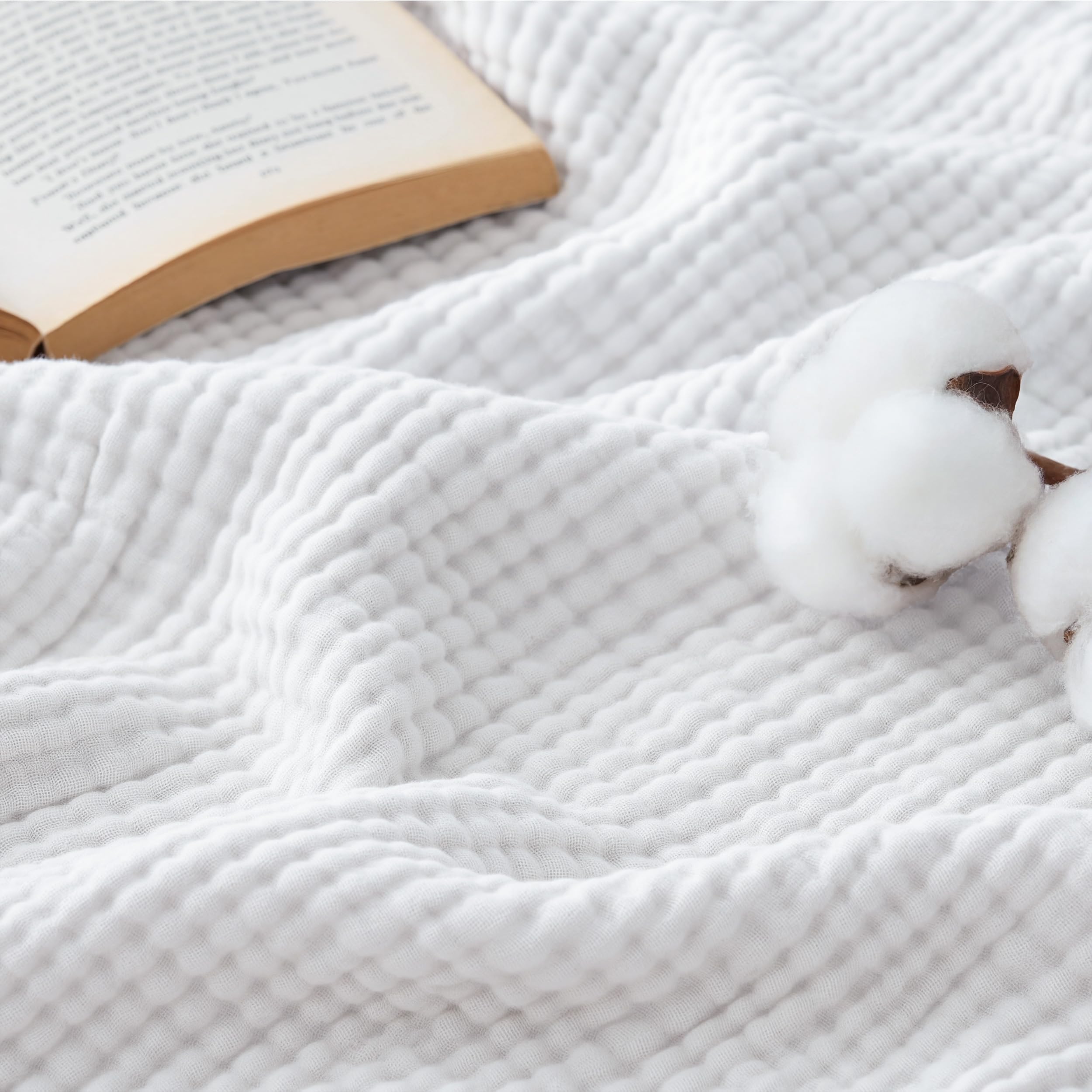 Bedsure cotton muslin blanket on bed showing drape and breathable comfort for lounging