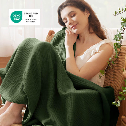 Bedsure olive green throw draped on a couch to illustrate lightweight warmth