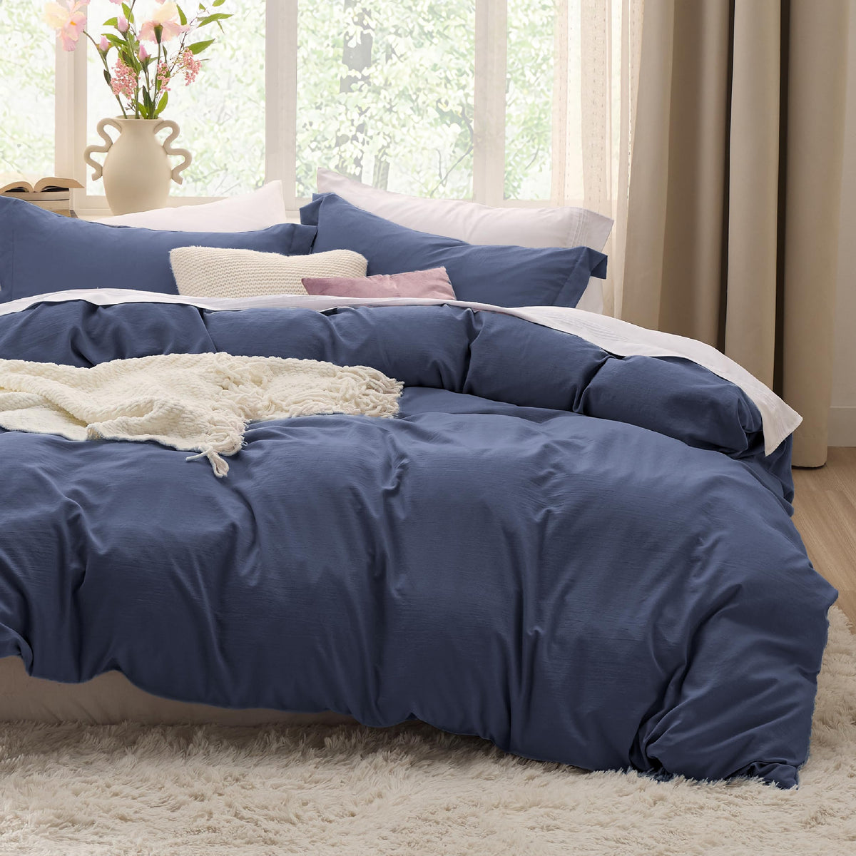 Bedsure navy blue California King duvet cover for soft, breathable comfort.