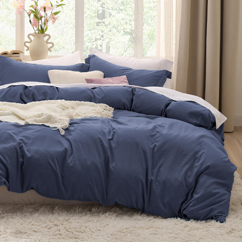 Bedsure navy blue California King duvet cover for soft, breathable comfort.
