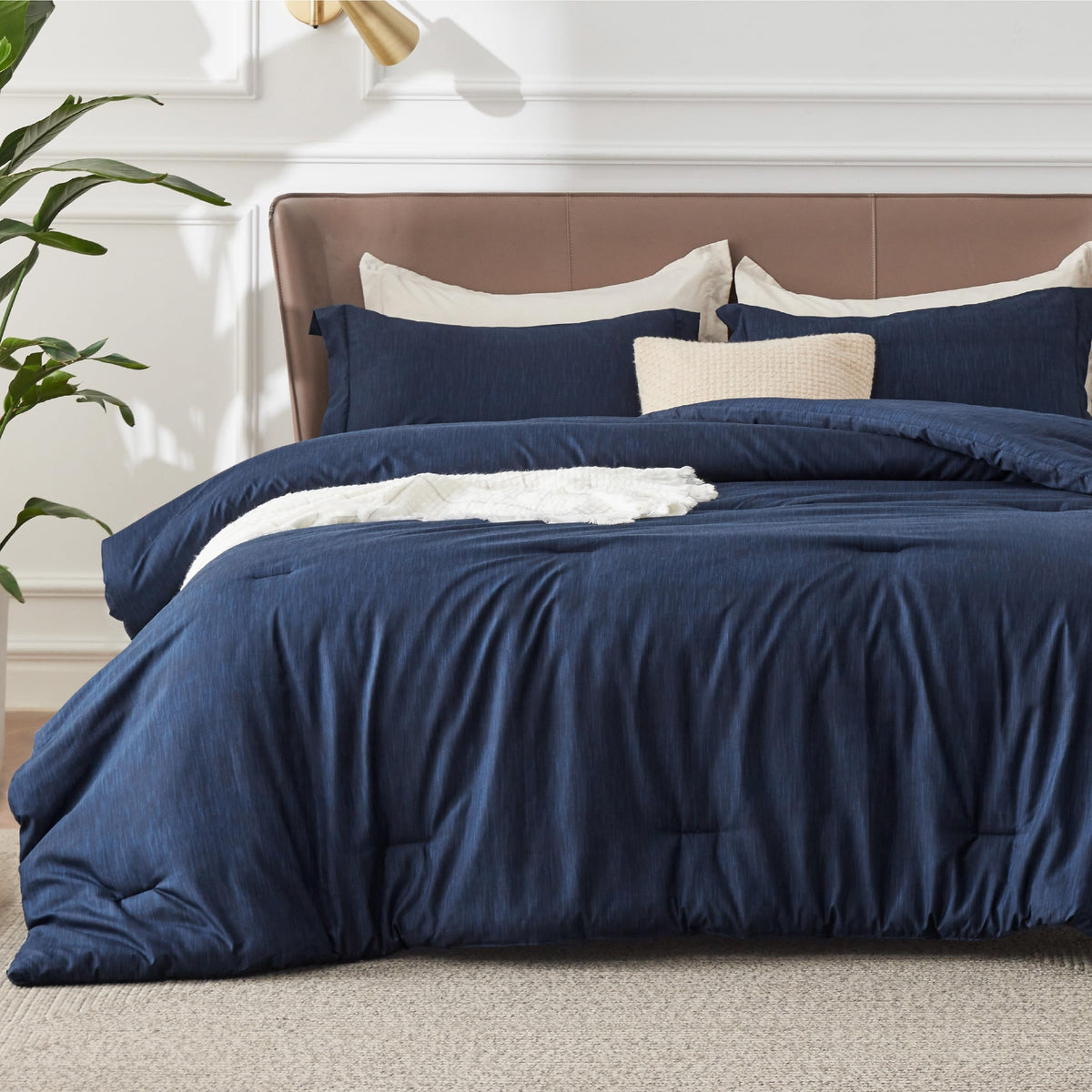 Bedsure navy blue queen comforter ensemble on bed showing all season softness